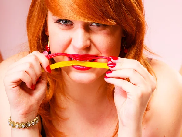 Woman eating  candies. — Stock Photo, Image