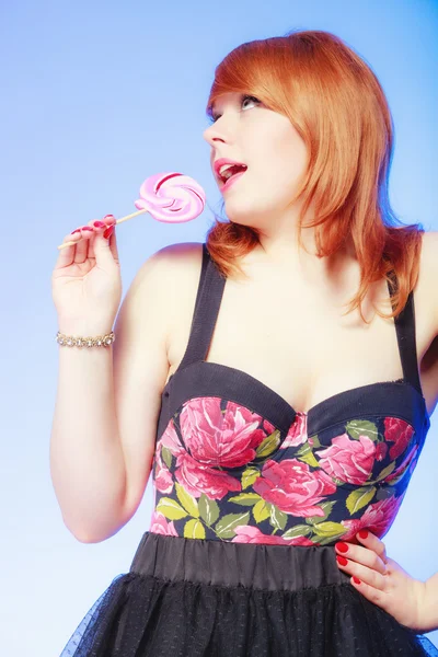 Woman holding candy — Stock Photo, Image