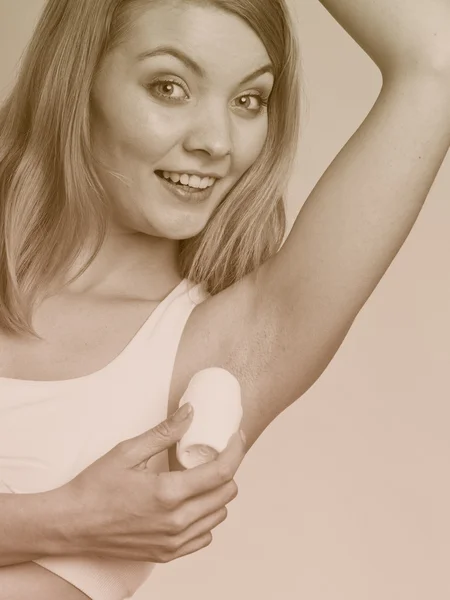 Girl applying stick deodorant — Stock Photo, Image