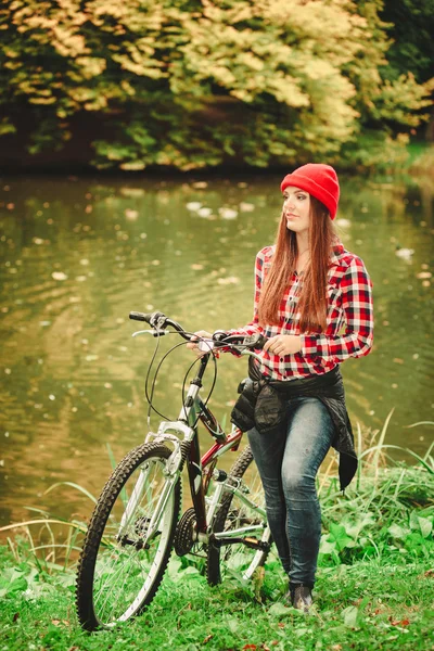 Woman relaxing with bicycle. — Stock Photo, Image