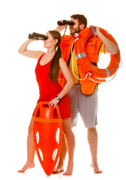 Lifeguards looking through binoculars — Stock Photo, Image