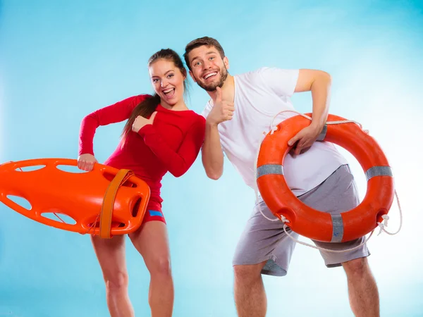 Lifeguard couple showing thumbs up — Stock Photo, Image