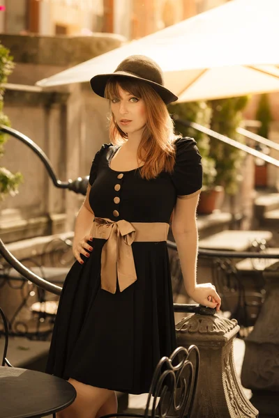 Retro style fashion woman in old town — Stock Photo, Image