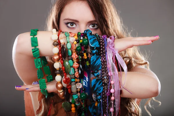 Woman holding necklaces — Stock Photo, Image