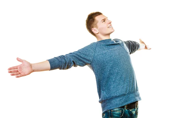 Young man with arms raised — Stock Photo, Image