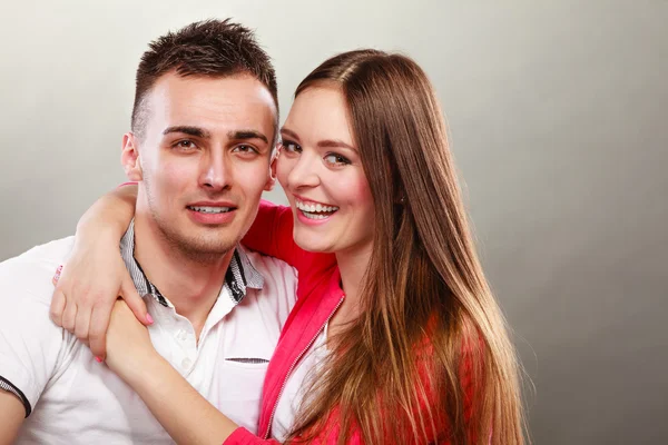 Smiling young couple hugging. — Stock Photo, Image