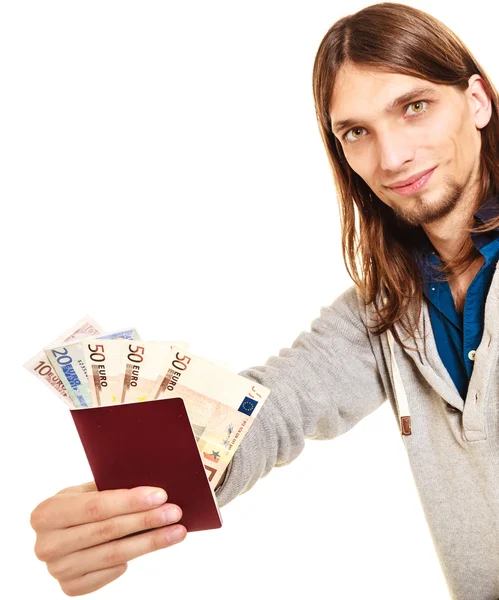 Tourist  holding passport full of money. — Stock Photo, Image