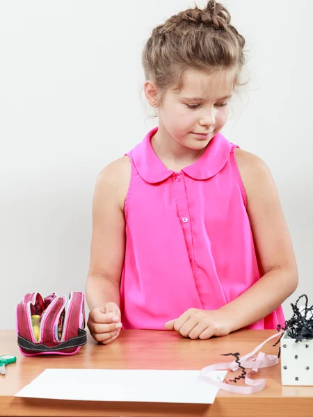 Little girl searching for her accessories. — Stock Photo, Image