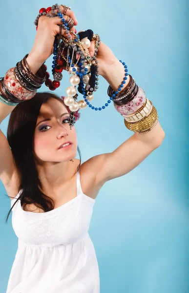 Summer girl with plenty of jewellery, beads in hands — Stock Photo, Image