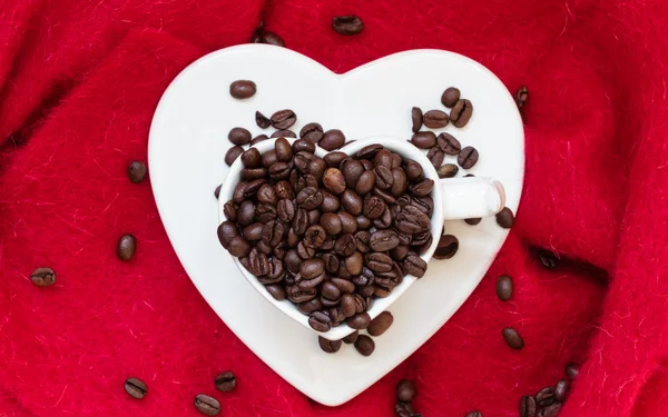 Cup filled with roasted coffee beans — Stock Photo, Image