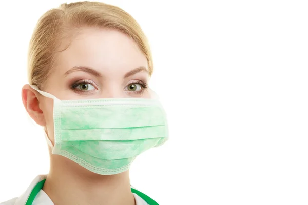 Jonge vrouw arts in het gezicht chirurgische masker Stockfoto