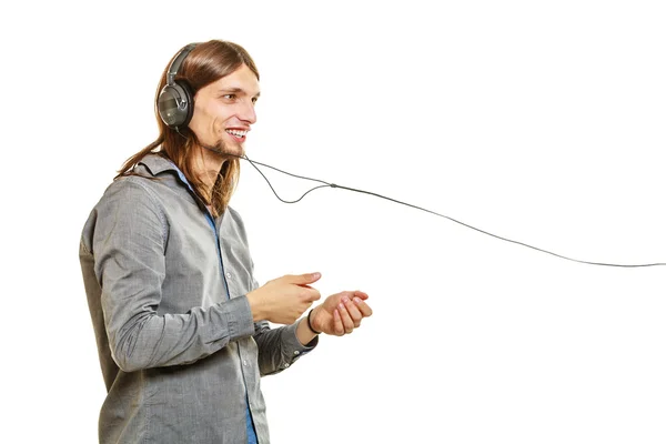 Hombre con auriculares escuchando música. Ocio . — Foto de Stock