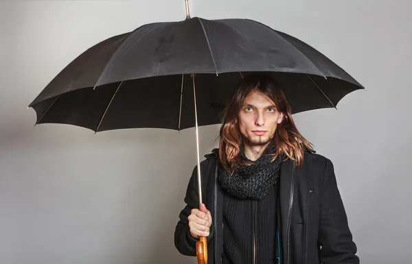 Handsome fashion man portrait wearing black coat. — Stock Photo, Image