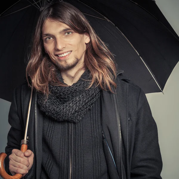 Handsome fashion man portrait wearing black coat. — Stock Photo, Image