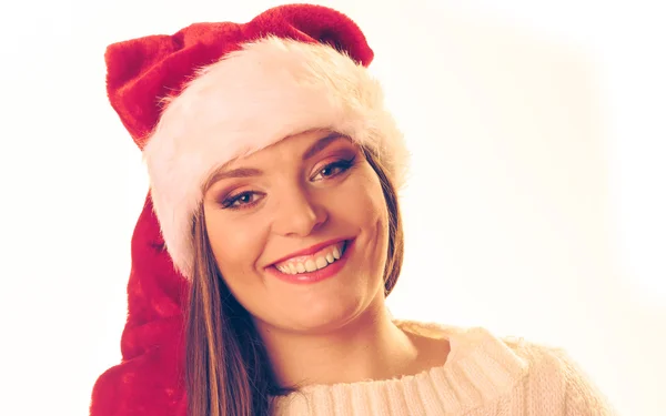 Smiling beautiful woman in santa hat. — Stock Photo, Image