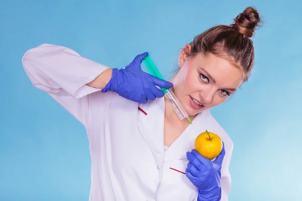 Scientist, doctor injecting apple — Stock Photo, Image