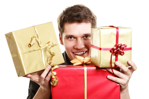 Holiday. Young man giving presents gifts boxes — Stock Photo, Image
