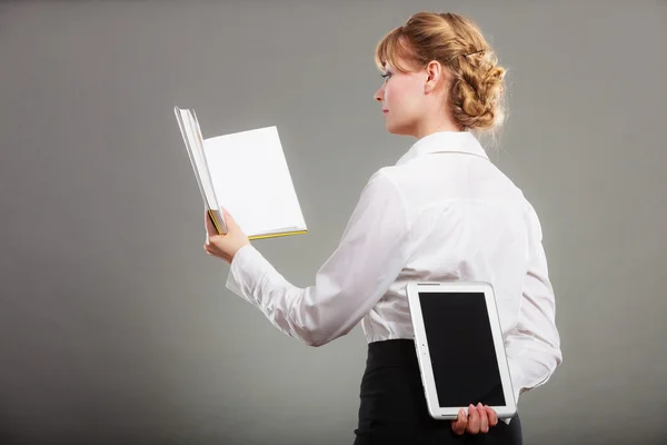 Girl holding digital tablet pc and textbook. — Stock Photo, Image