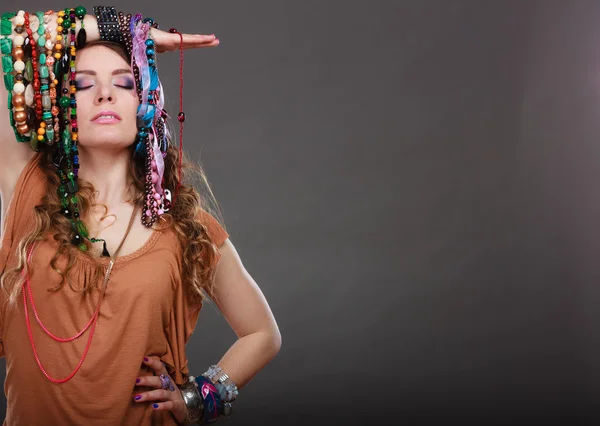 Woman holding necklaces — Stock Photo, Image