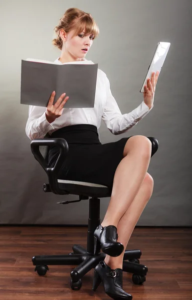 Girl holding digital tablet  and textbook. — Stock Photo, Image