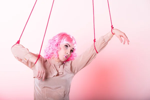 Woman girl stylized like marionette puppet on string — Stock Photo, Image