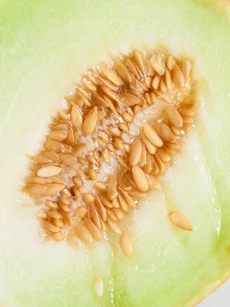 Closeup melon with pips as food background. — Stock Photo, Image