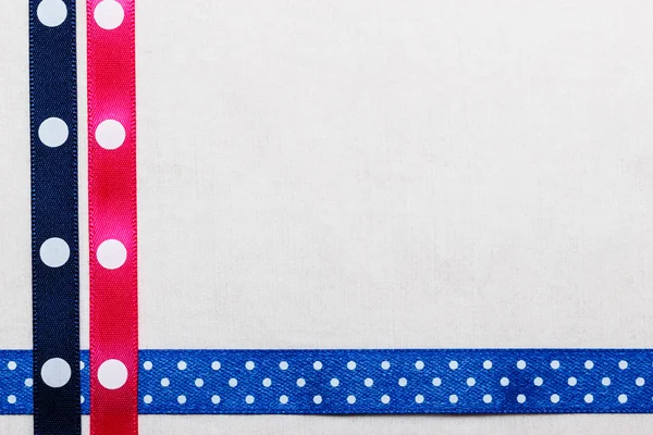 Dotted blue pink ribbon frame on white cloth — Stock Photo, Image