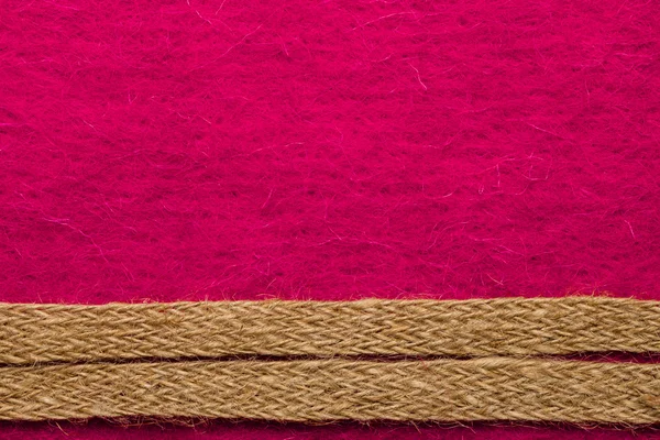 Jute rope over pink background — Stock Photo, Image