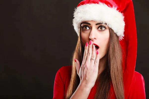 Surprised woman wearing santa claus hat — Stock Photo, Image