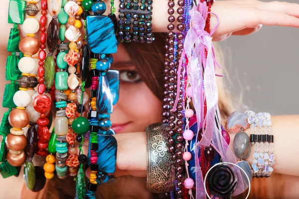 Woman holding many necklaces — Stock Photo, Image