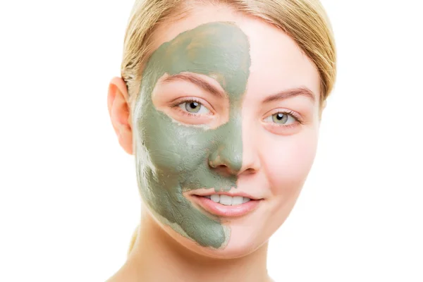 Woman in clay mud mask on face isolated on white. — Stock Photo, Image