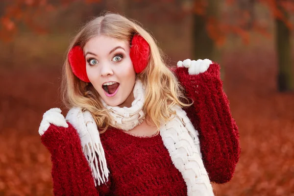 Woman in red earmuffs. — Stock Photo, Image