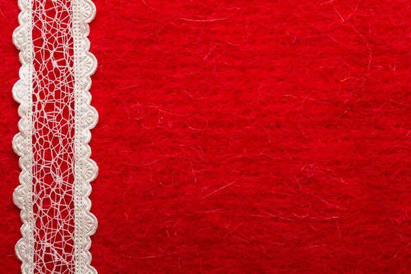 Kırmızı bir arka plan üzerinde Vintage beyaz dantel — Stok fotoğraf