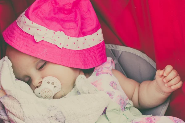 Closeup of little baby covered with pink hat. — Stock Photo, Image