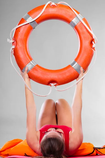 Woman holding life buoy ring — Stock Photo, Image