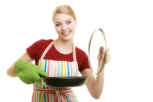 Housewife or chef in kitchen apron with skillet frying pan — Stock Photo, Image