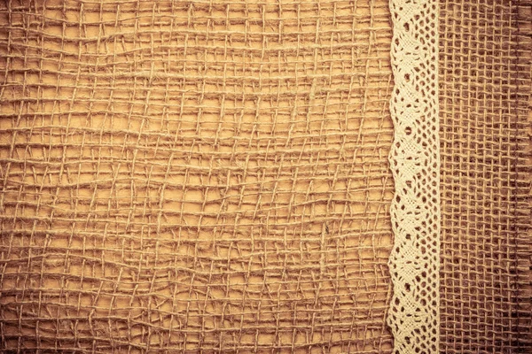 Lace frame on burlap cloth — Stock Photo, Image