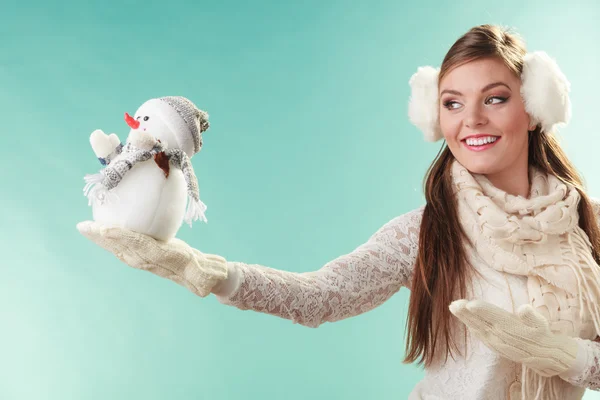 Woman holding little snowman — Stock Photo, Image