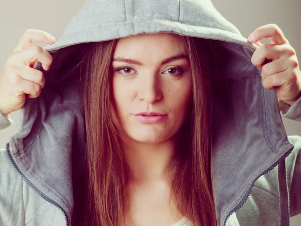 Portrait of pensive teenager girl in hood. — Stockfoto