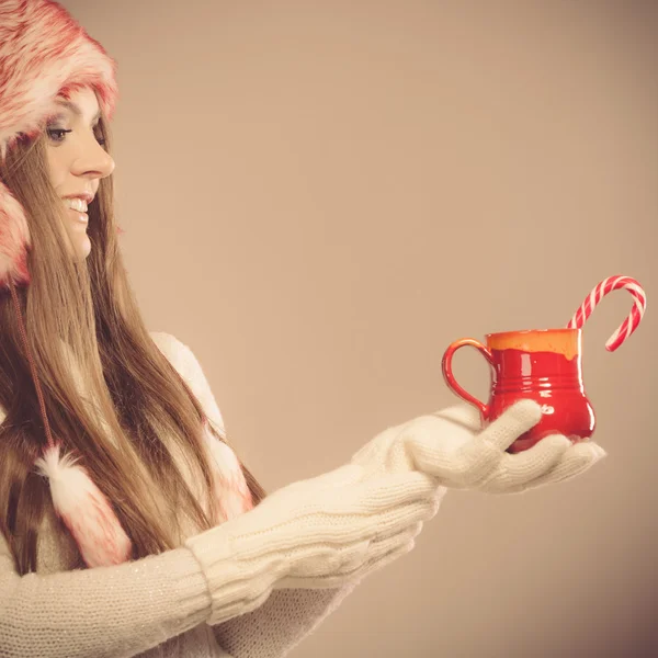 Girl with cane in xmas mug. — Stock Photo, Image