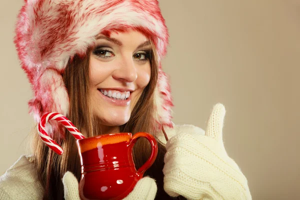 Girl with cane in xmas mug. — Stock Photo, Image