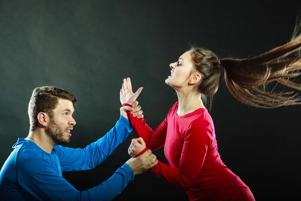 Woman wife abusing scared man husband. Violence. — Stock Photo, Image