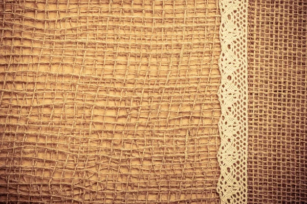 Lace frame on burlap cloth background — Stock Photo, Image