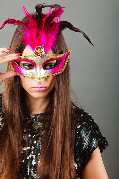 Woman face with carnival mask on gray — Stock Photo, Image