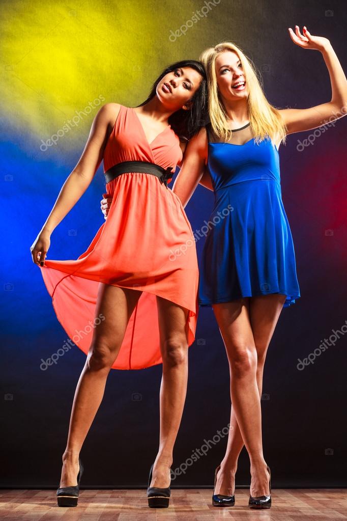 Two funny women in dresses. Stock Photo by ©Voyagerix 89051552