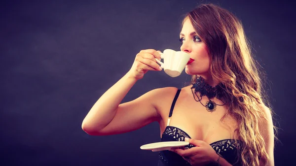 Model wearing lingerie with beverage — Stock Photo, Image