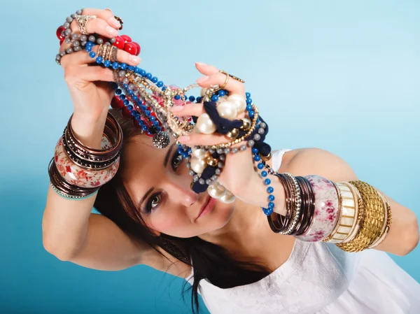 Summer girl with plenty of jewellery, beads in hands — Stock Photo, Image