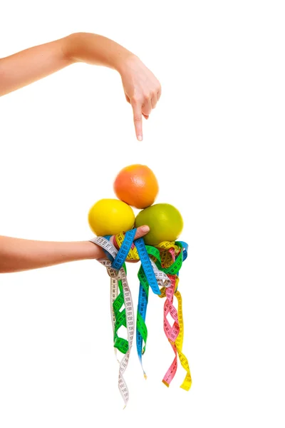 Hand showing  colorful measure tapes — Stockfoto