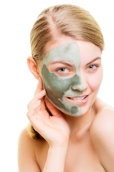 Woman in clay mud mask on face isolated on white. — Stock Photo, Image
