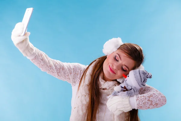 Cute woman holding little snowman — Stock Photo, Image